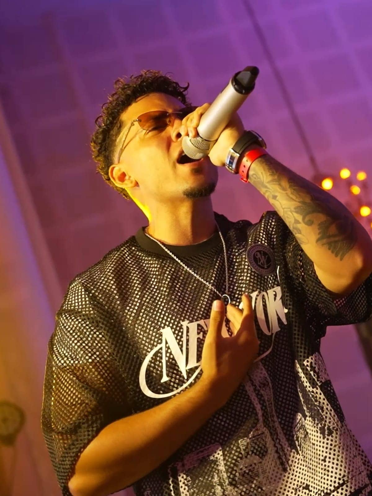 A singer performing live on stage
